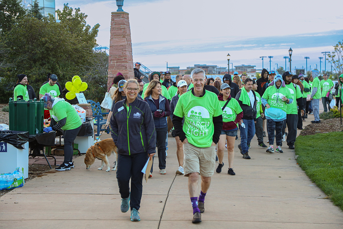 Photo of community members walking in March Into the Light in Colorado Springs, CO