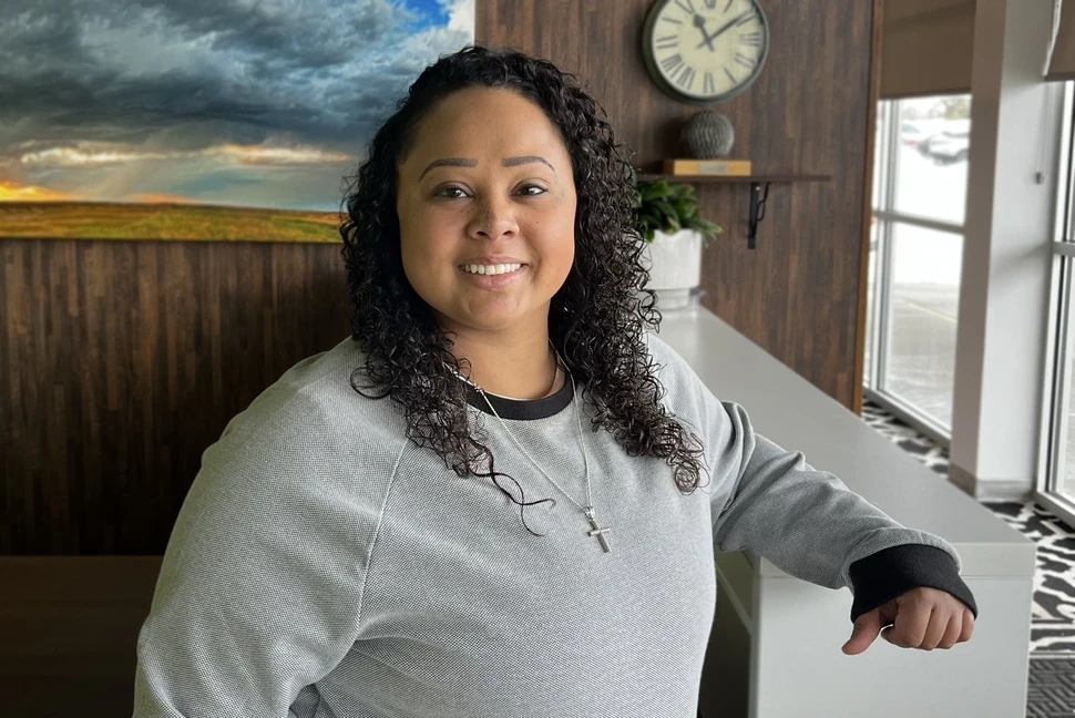 Photo of Shannon, woman in office