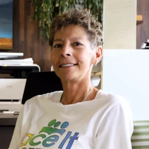 Photo of woman with short, curly hair