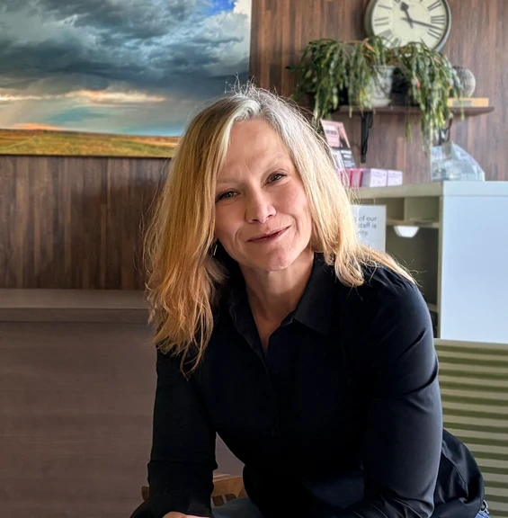 Photo of woman sitting in office